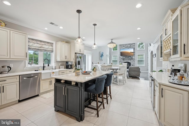 3357 Huntingdon Pike, Huntingdon Valley, PA 19006 - kitchen featuring stainless steel appliances, light countertops, a sink, a kitchen bar, and open floor plan
