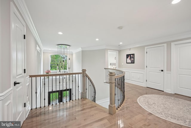 3357 Huntingdon Pike, Huntingdon Valley, PA 19006 - hallway with an upstairs landing, a decorative wall, ornamental molding, wood finished floors, and recessed lighting