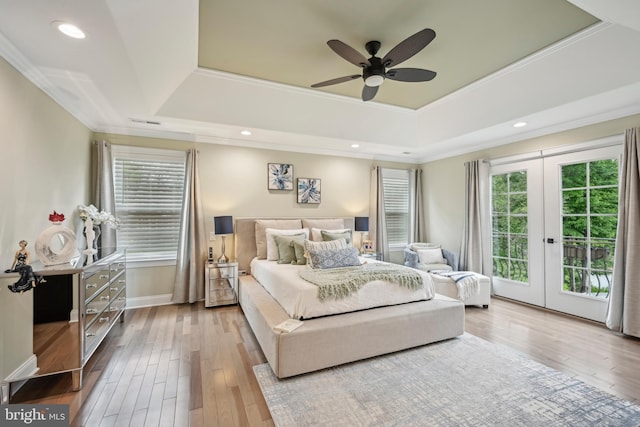 3357 Huntingdon Pike, Huntingdon Valley, PA 19006 - bedroom featuring a tray ceiling, multiple windows, access to exterior, wood finished floors, and ornamental molding