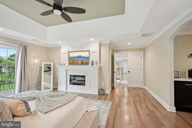 3357 Huntingdon Pike, Huntingdon Valley, PA 19006 - bedroom featuring arched walkways, a raised ceiling, light wood-style flooring, a fireplace, and recessed lighting