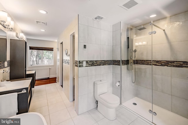 full bath with vanity, visible vents, toilet, tile patterned floors, and a stall shower