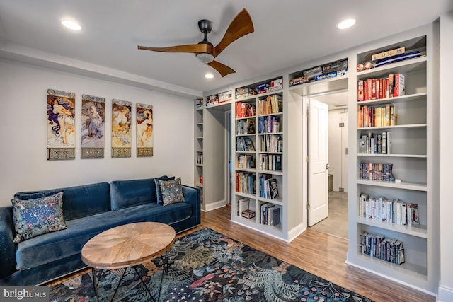 sitting room featuring a ceiling fan, baseboards, recessed lighting, and wood finished floors