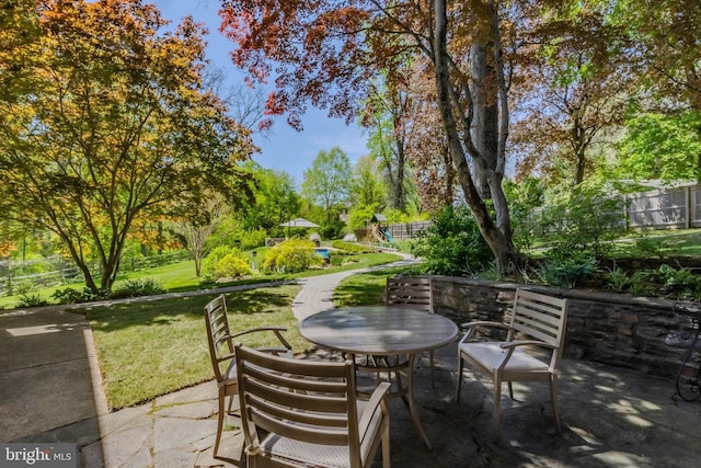 view of patio / terrace with fence and outdoor dining space