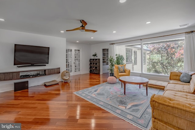 living area featuring visible vents, wood finished floors, baseboards, ceiling fan, and recessed lighting