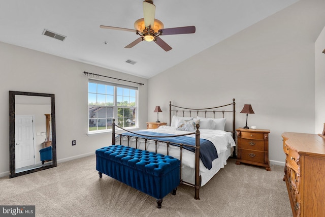 carpeted bedroom with baseboards, visible vents, ceiling fan, and vaulted ceiling