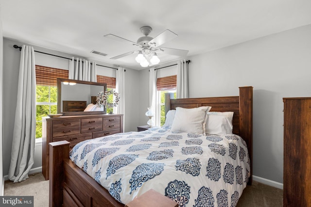 bedroom featuring baseboards, multiple windows, carpet flooring, and visible vents