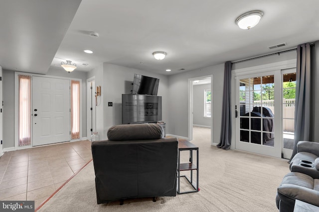 living room featuring visible vents, recessed lighting, baseboards, and light tile patterned floors