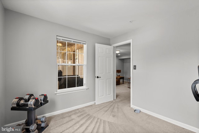 unfurnished bedroom with carpet flooring and baseboards