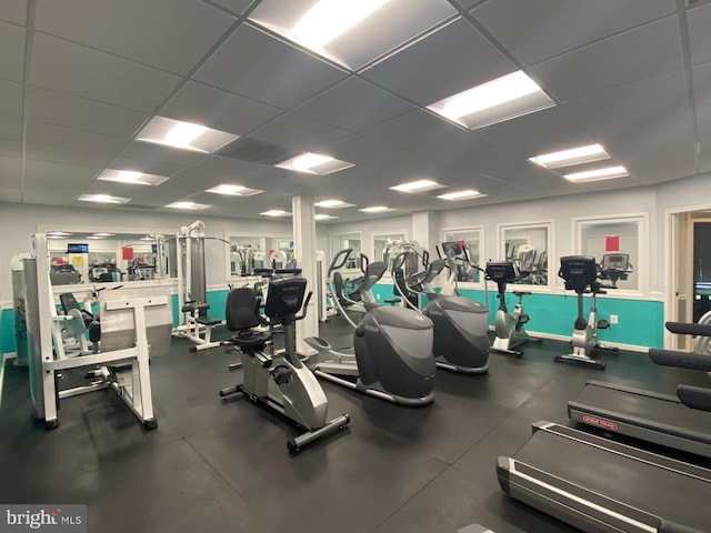 exercise room featuring a drop ceiling