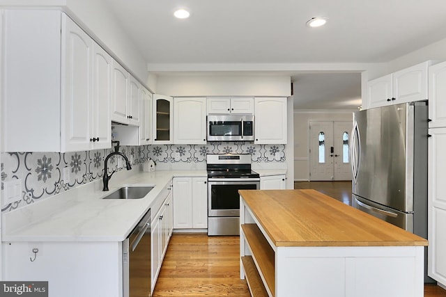 13407 Brookfield Dr, Chantilly, VA 20151 - kitchen with stainless steel appliances, a sink, wooden counters, a center island, and recessed lighting