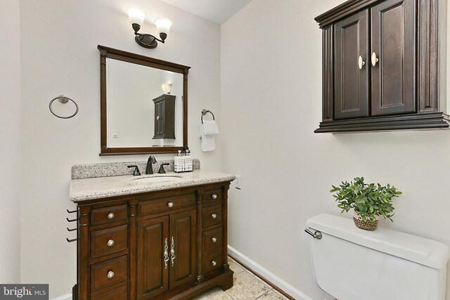 13407 Brookfield Dr, Chantilly, VA 20151 - half bathroom featuring baseboards, vanity, toilet, and tile patterned floors