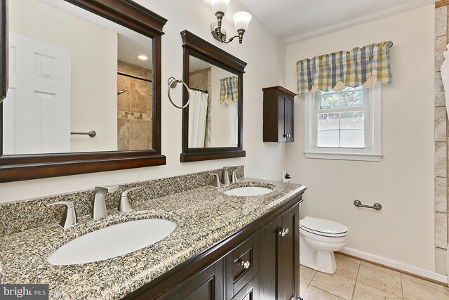 13407 Brookfield Dr, Chantilly, VA 20151 - full bathroom featuring toilet, baseboards, double vanity, tile patterned floors, and a shower with curtain