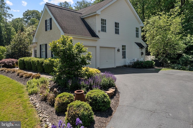 139 Watson Mill Rd, Landenberg, PA 19350 - view of side of home with asphalt driveway, a shingled roof, and a garage