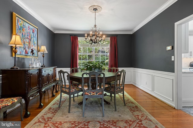 139 Watson Mill Rd, Landenberg, PA 19350 - dining room with a chandelier, wood finished floors, wainscoting, crown molding, and a decorative wall