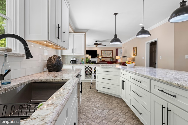 139 Watson Mill Rd, Landenberg, PA 19350 - kitchen with a sink, tasteful backsplash, brick patterned floors, white cabinets, and crown molding
