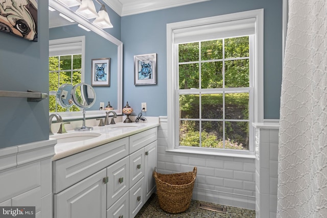 139 Watson Mill Rd, Landenberg, PA 19350 - bathroom with healthy amount of natural light, double vanity, ornamental molding, a wainscoted wall, and tile walls