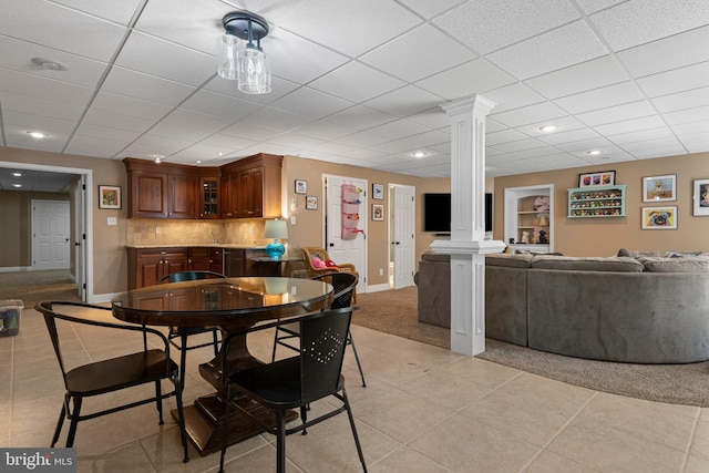 139 Watson Mill Rd, Landenberg, PA 19350 - dining area featuring ornate columns, light tile patterned floors, baseboards, light carpet, and a drop ceiling