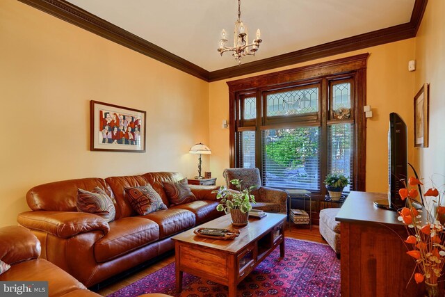 2636 N Calvert St N, Baltimore, MD 21218 - living area featuring wood finished floors, a chandelier, and crown molding