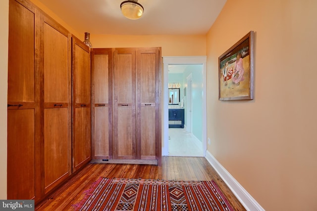 2636 N Calvert St N, Baltimore, MD 21218 - hall with dark wood-style flooring and baseboards