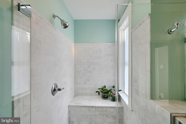 2636 N Calvert St N, Baltimore, MD 21218 - bathroom featuring healthy amount of natural light, tiled shower, and tile walls