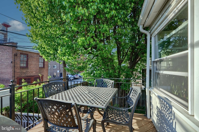 2636 N Calvert St N, Baltimore, MD 21218 - wooden terrace featuring outdoor dining area