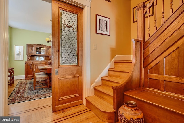 2636 N Calvert St N, Baltimore, MD 21218 - stairway with wood-type flooring and baseboards