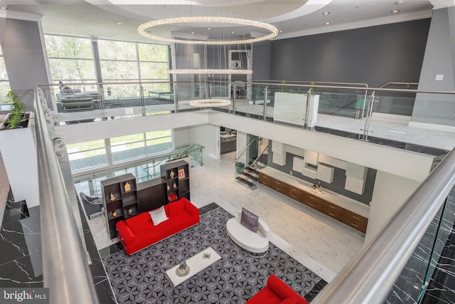 community lobby featuring ornamental molding and recessed lighting