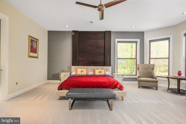 bedroom with light colored carpet, baseboards, recessed lighting, and ceiling fan