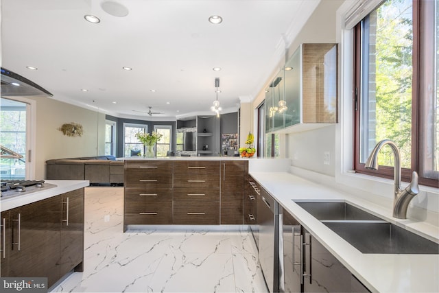 kitchen featuring a sink, modern cabinets, recessed lighting, stainless steel appliances, and light countertops