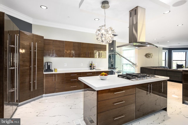 kitchen with island exhaust hood, light marble finish floors, modern cabinets, ornamental molding, and recessed lighting