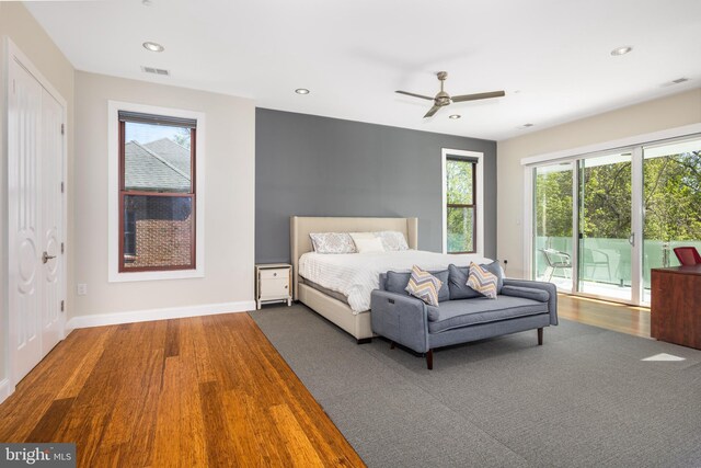 bedroom featuring access to exterior, wood finished floors, recessed lighting, baseboards, and a ceiling fan