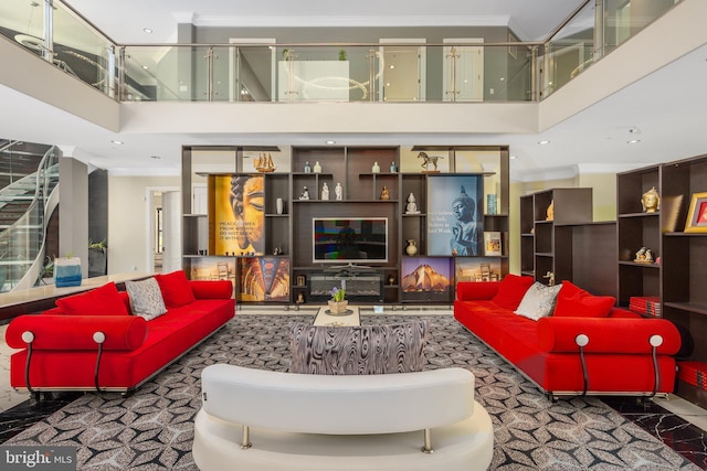carpeted living room featuring ornamental molding, a high ceiling, and recessed lighting