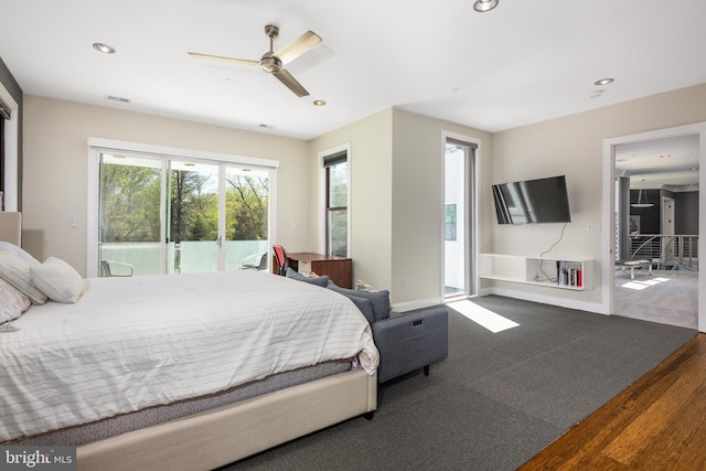 bedroom with access to exterior, multiple windows, recessed lighting, wood finished floors, and a ceiling fan