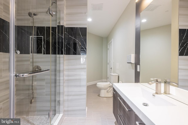 full bathroom featuring a shower stall, vanity, toilet, tile patterned floors, and recessed lighting