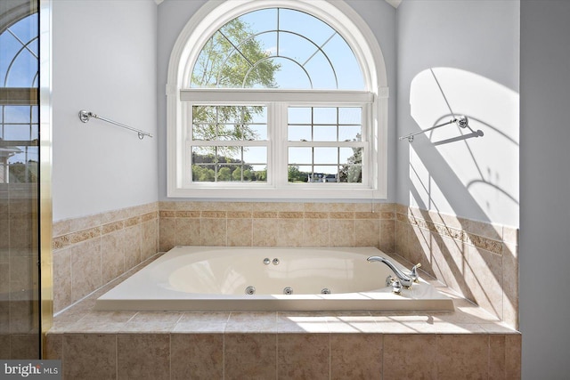 full bathroom with a whirlpool tub