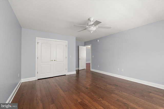 unfurnished bedroom with baseboards, ceiling fan, and wood finished floors