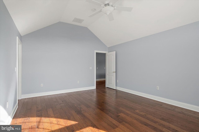 empty room with baseboards, a ceiling fan, dark wood finished floors, and lofted ceiling