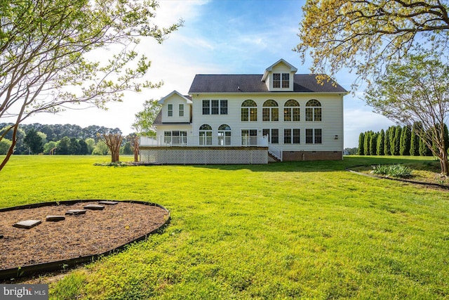 back of property featuring a lawn, crawl space, and stairs