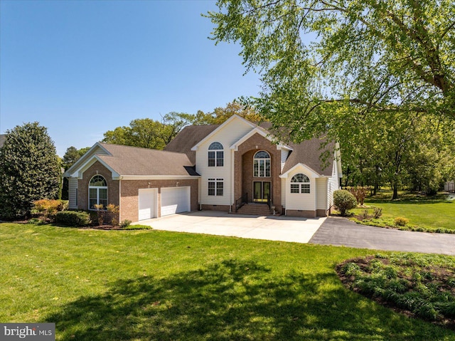 traditional-style home featuring concrete driveway, brick siding, an attached garage, and a front yard