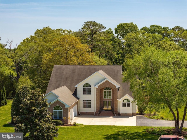 view of front facade with crawl space, a garage, driveway, and a front lawn
