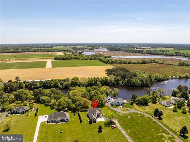 birds eye view of property with a water view and a rural view