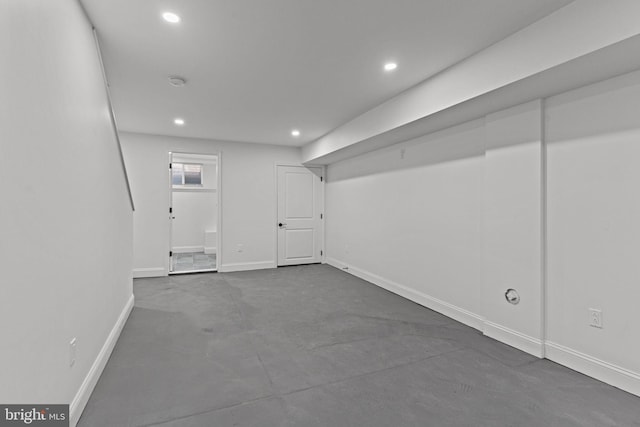 basement with recessed lighting and baseboards