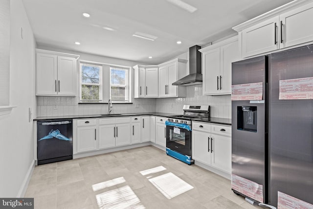 kitchen featuring dark countertops, wall chimney exhaust hood, a sink, appliances with stainless steel finishes, and backsplash