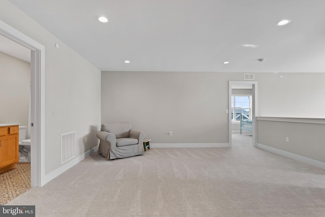 unfurnished room with visible vents, recessed lighting, and light colored carpet