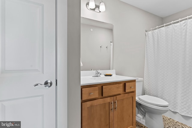 bathroom featuring vanity, tile patterned floors, toilet, and a shower with curtain
