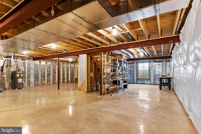 below grade area with stairs and water heater