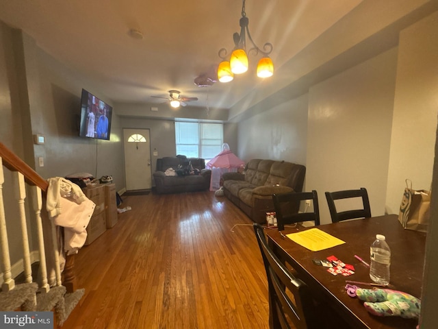 1107 E 11th St, Crum Lynne, PA 19022 - dining area with wood finished floors, a ceiling fan, and a chandelier
