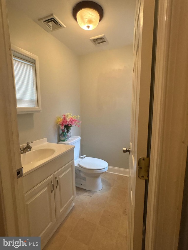 1107 E 11th St, Crum Lynne, PA 19022 - bathroom with vanity, toilet, baseboards, and tile patterned floors