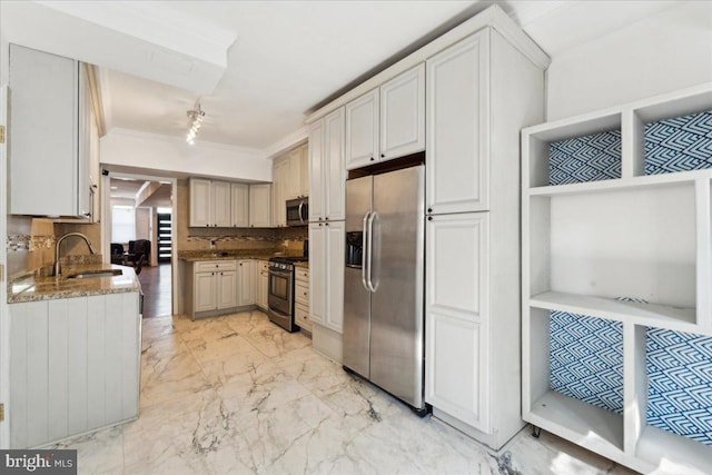 kitchen with stainless steel appliances, a sink, decorative backsplash, stone countertops, and light marble finish floors