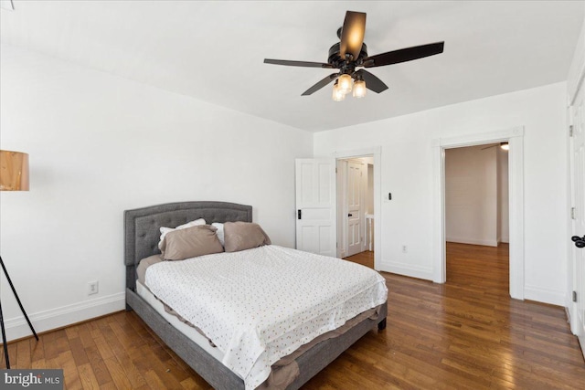 bedroom featuring wood finished floors, baseboards, and ceiling fan